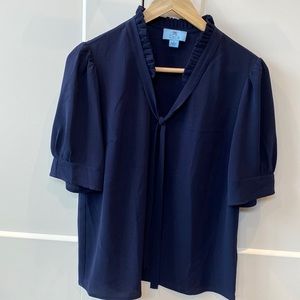 Short sleeve navy blouse.